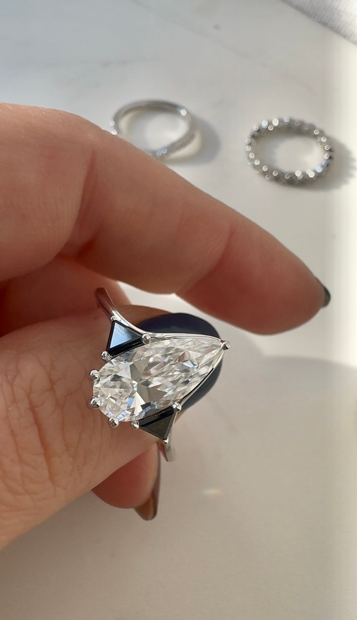 Moissanite Elongated Pear with Black Side Stones Engagement Ring