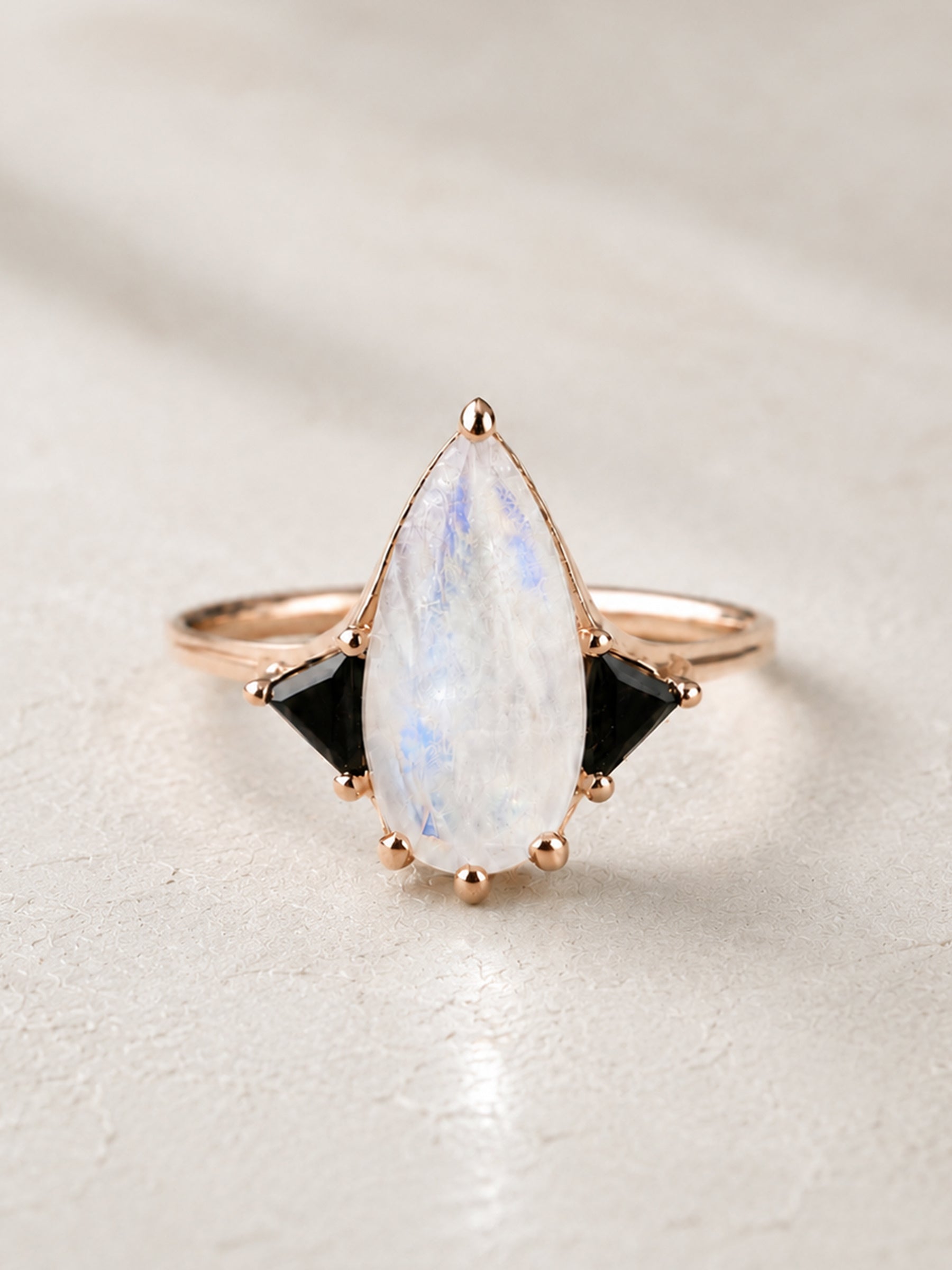 Moonstone Elongated Pear with Black Side Stones Engagement Ring