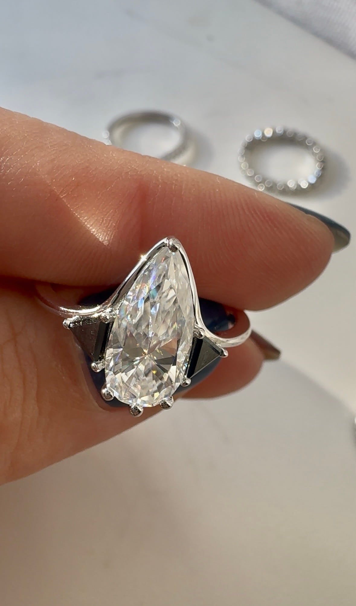 Moissanite Elongated Pear with Black Side Stones Engagement Ring