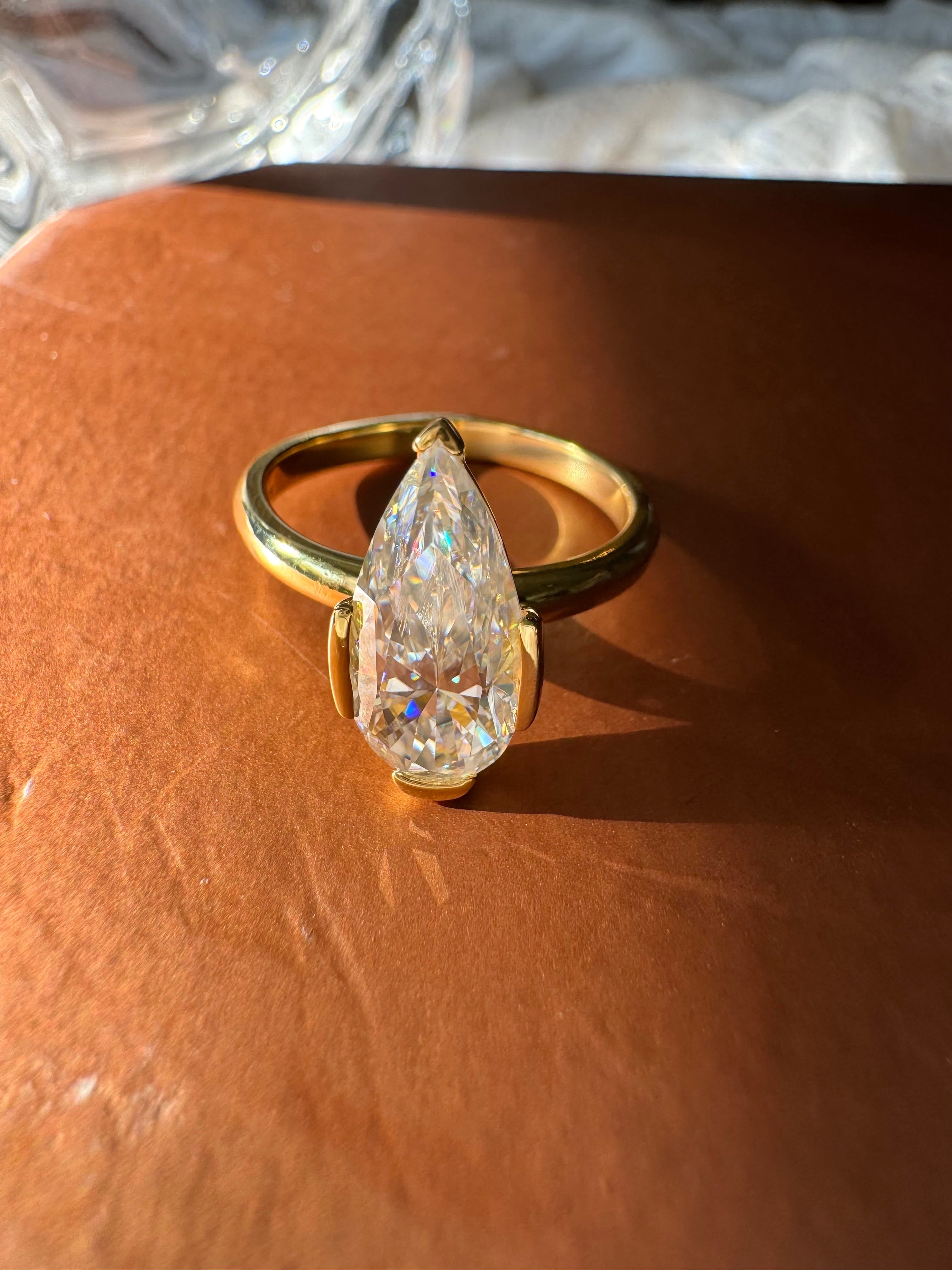 Moissanite Elongated Pear Bezel Prong Ring
