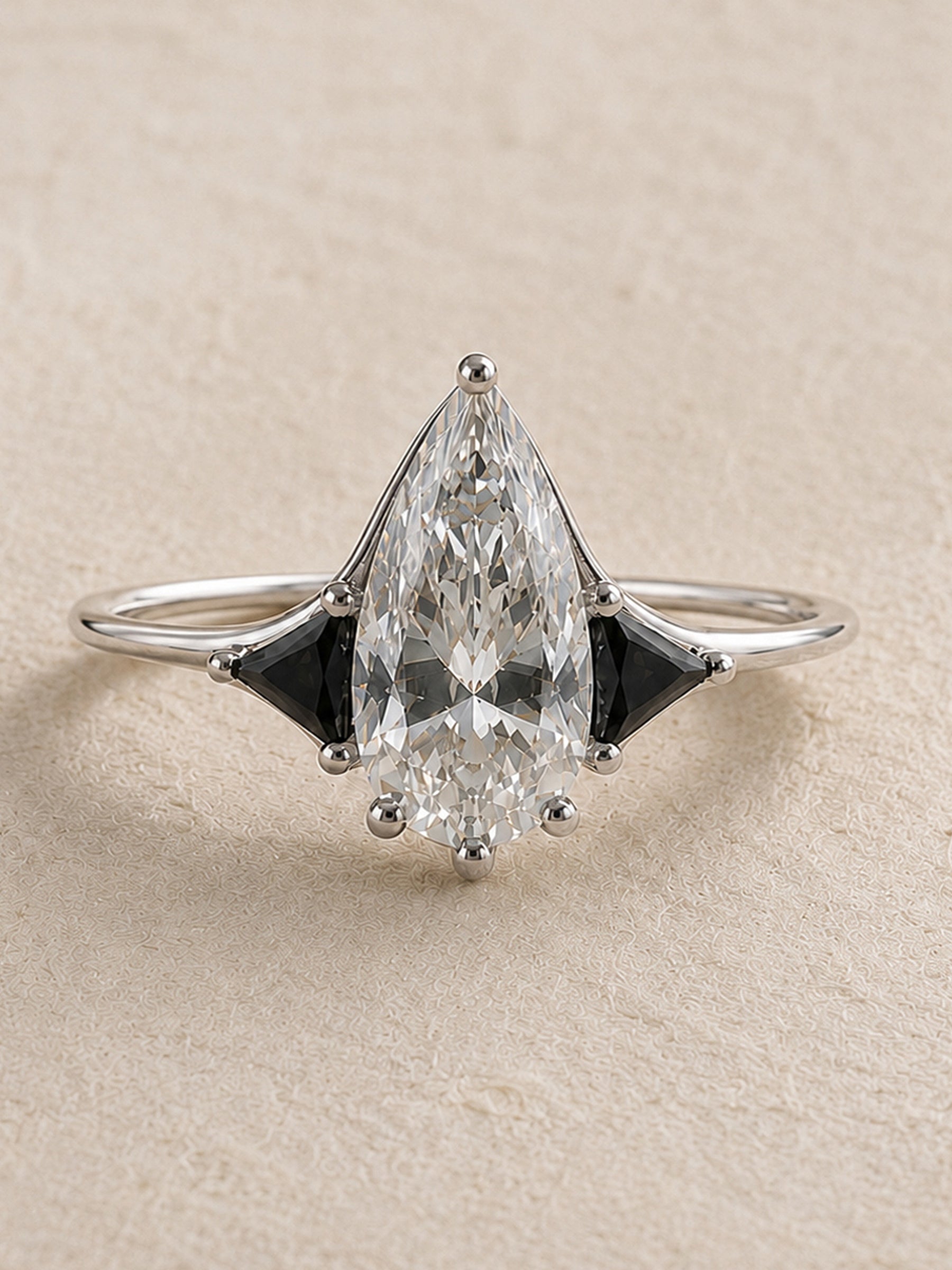 Moissanite Elongated Pear with Black Side Stones Engagement Ring