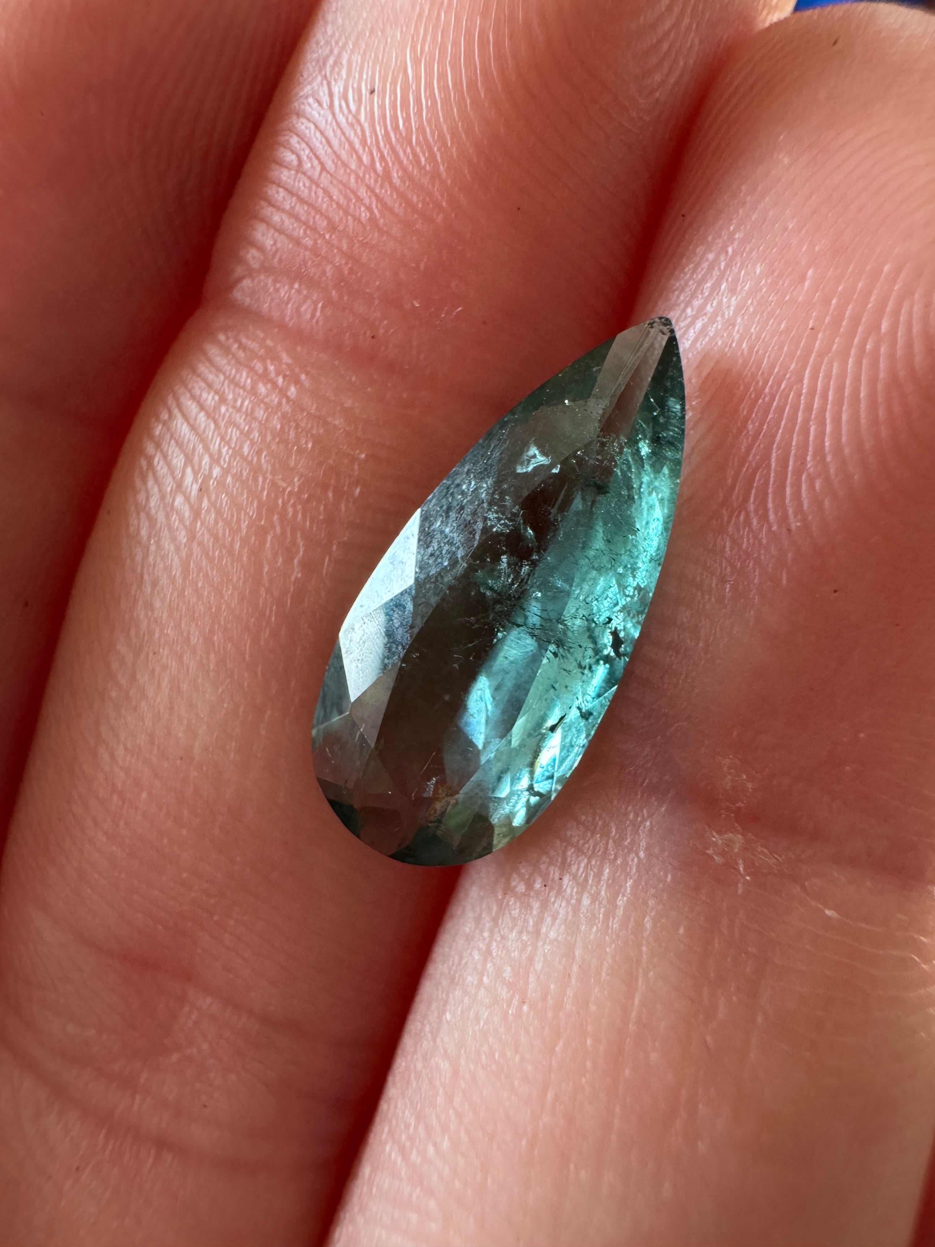 Blue Tourmaline Elongated Pear with Black Diamond Side Stones Engagement Ring