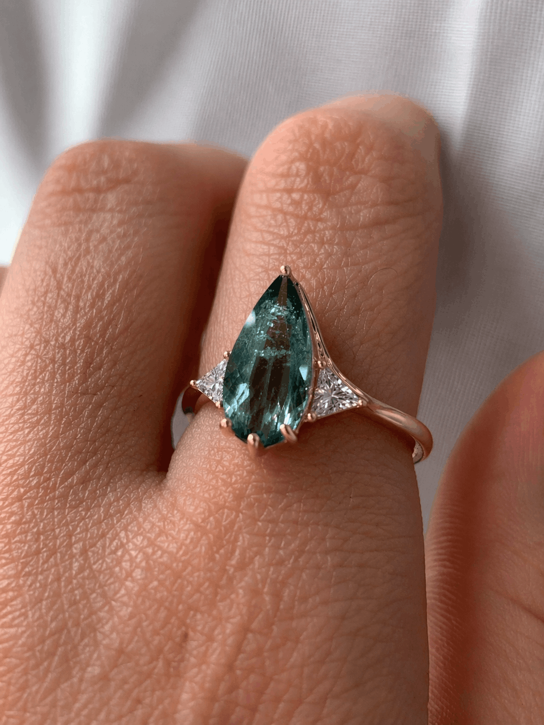 Blue Tourmaline Elongated Pear with White Diamond Side Stones Engagement Ring