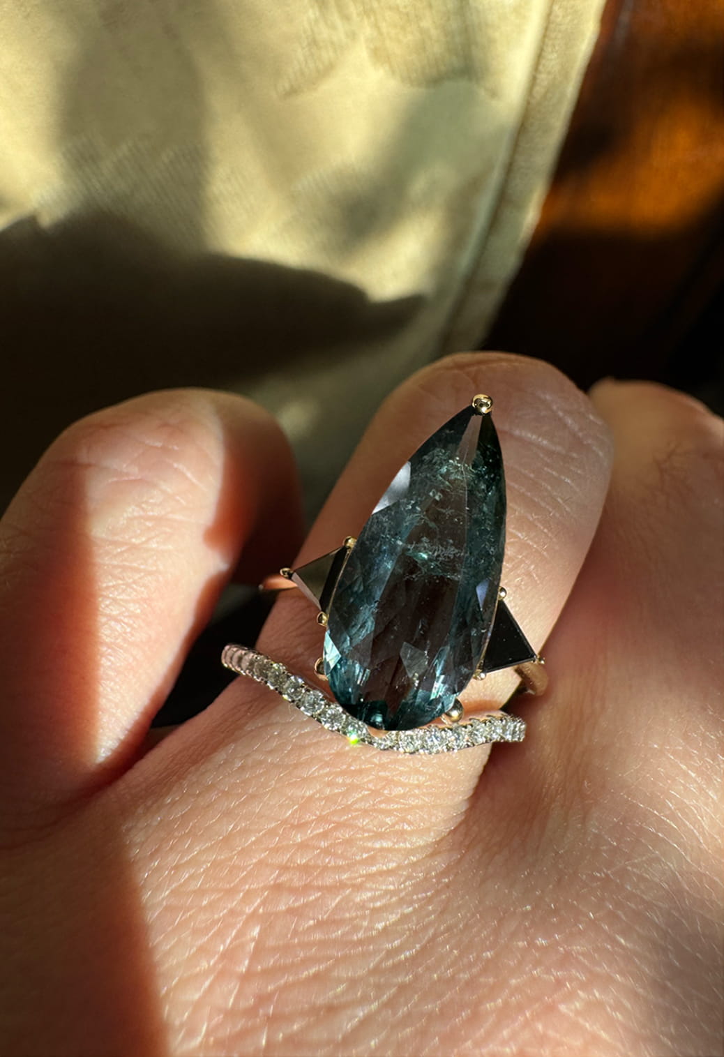 Blue Tourmaline Elongated Pear with Black Diamond Side Stones Engagement Ring