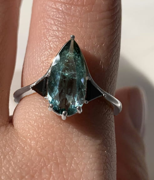 Blue Tourmaline Elongated Pear with Black Diamond Side Stones Engagement Ring