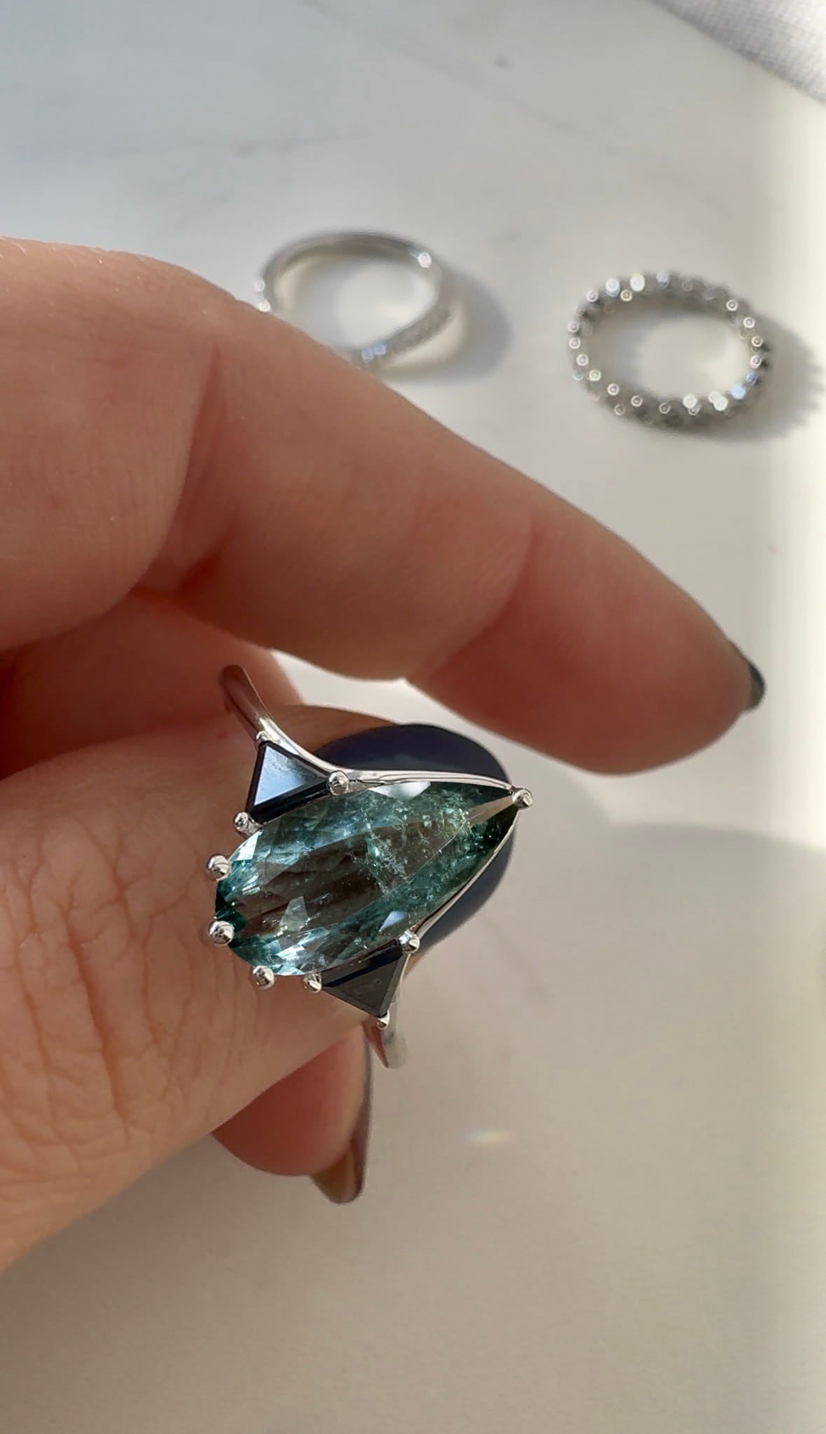 Blue Tourmaline Elongated Pear with Black Diamond Side Stones Engagement Ring